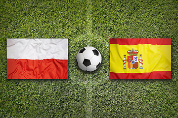 Image showing Poland vs. Spain flags on soccer field