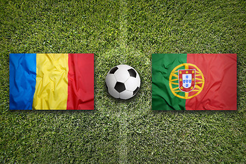 Image showing Romania vs. Portugal flags on soccer field