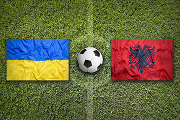 Image showing Ukraine vs. Albania flags on soccer field