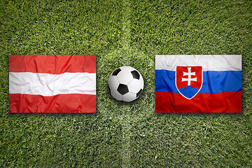 Image showing Austria vs. Slovakia flags on soccer field