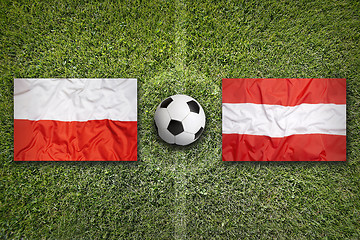 Image showing Poland vs. Austria flags on soccer field