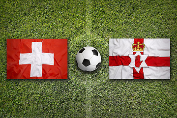 Image showing Switzerland vs. Northern Ireland flags on soccer field