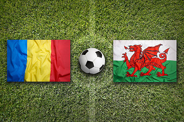 Image showing Romania vs. Wales flags on soccer field