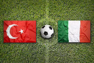 Image showing Turkey vs. Italy flags on soccer field