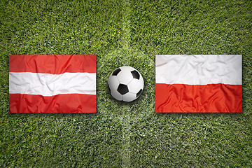 Image showing Austria vs. Poland flags on soccer field