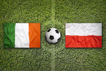 Image showing Ireland vs. Poland flags on soccer field