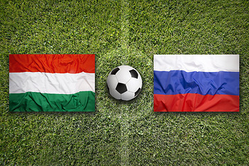 Image showing Hungary vs. Russia flags on soccer field