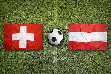 Image showing Switzerland vs. Austria flags on soccer field