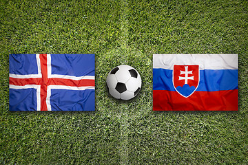 Image showing Iceland vs. Slovakia flags on soccer field