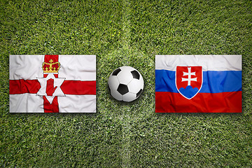 Image showing Northern Ireland vs. Slovakia flags on soccer field