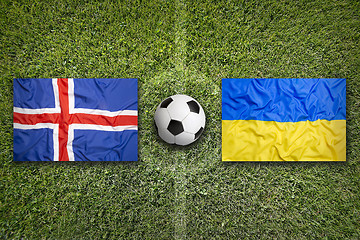 Image showing Iceland vs. Ukraine flags on soccer field