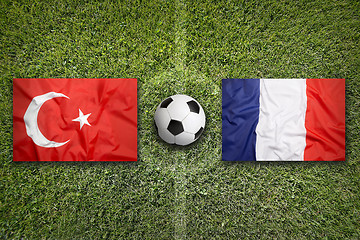 Image showing Turkey vs. France flags on soccer field