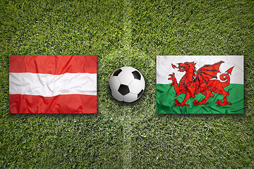 Image showing Austria vs. Wales flags on soccer field