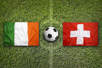 Image showing Ireland vs. Switzerland flags on soccer field