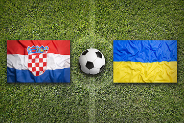 Image showing Croatia vs. Ukraine flags on soccer field