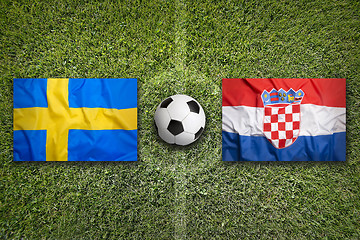 Image showing Sweden vs. Croatia flags on soccer field