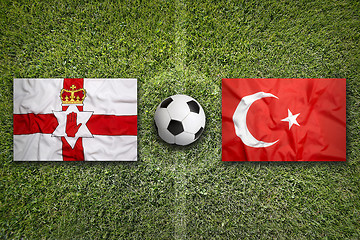 Image showing Northern Ireland vs. Turkey flags on soccer field
