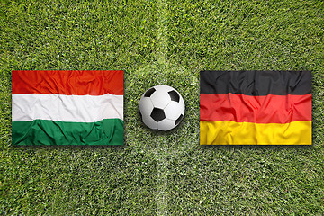 Image showing Hungary vs. Germany flags on soccer field