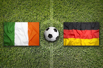 Image showing Ireland vs. Germany flags on soccer field