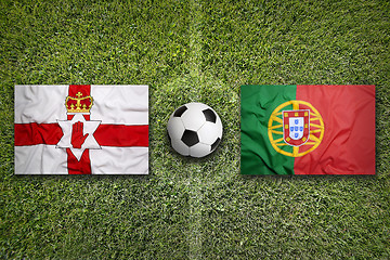 Image showing Northern Ireland vs. Portugal flags on soccer field