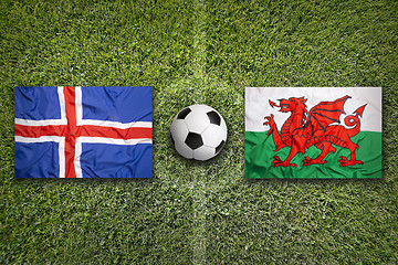 Image showing Iceland vs. Wales flags on soccer field