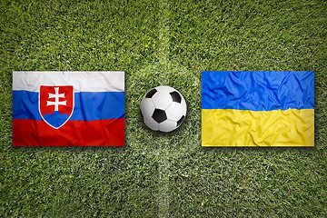 Image showing Slovakia vs. Ukraine flags on soccer field