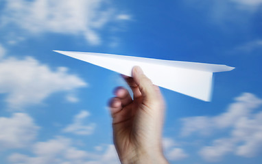 Image showing throwing a paper plane.. , motion blur