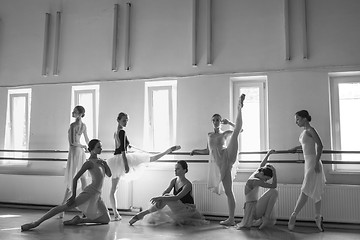 Image showing The seven ballerinas at ballet bar