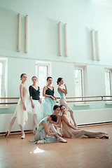 Image showing The seven ballerinas at ballet bar