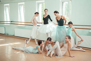 Image showing The seven ballerinas at ballet bar