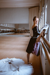 Image showing The young modern ballet dancer posing against the room background