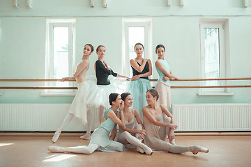 Image showing The seven ballerinas at ballet bar