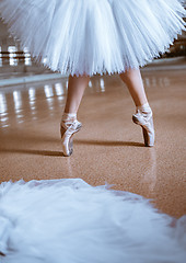 Image showing The close-up feet of young ballerina in pointe shoes