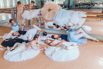 Image showing The seven ballerinas against ballet bar