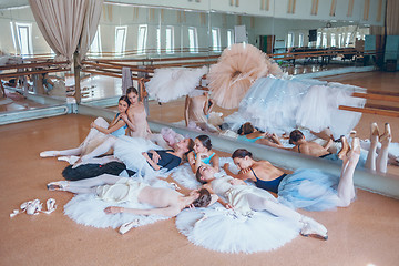 Image showing The seven ballerinas against ballet bar