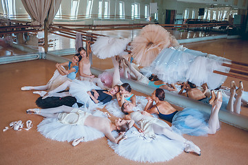 Image showing The seven ballerinas against ballet bar
