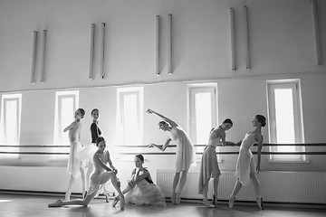 Image showing The seven ballerinas at ballet bar