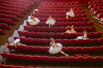 Image showing Ballerinas sitting in the empty auditorium theater