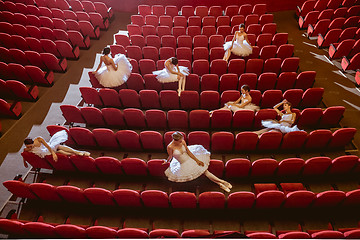 Image showing Ballerinas sitting in the empty auditorium theater