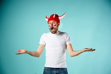 Image showing The face of football fan with different emotions on blue