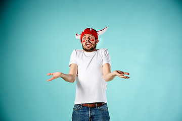 Image showing The face of football fan with different emotions on blue