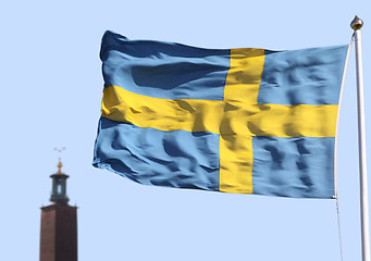 Image showing Stockholms city statshuset och svenska flaggan