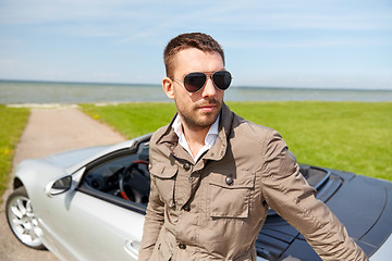 Image showing man near cabriolet car outdoors