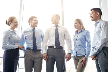 Image showing smiling businesspeople meeting in office