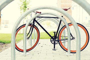 Image showing close up of fixed gear bicycle at street parking
