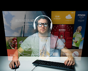 Image showing man in headset computer over virtual media screen