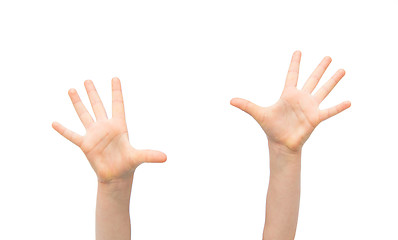 Image showing close up of little child hands raised upwards