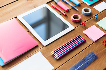 Image showing close up of school supplies and tablet pc