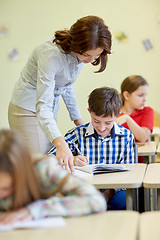 Image showing group of school kids writing test in classroom