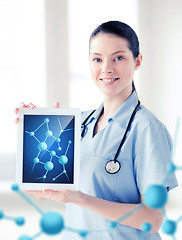 Image showing female doctor with tablet pc and molecules